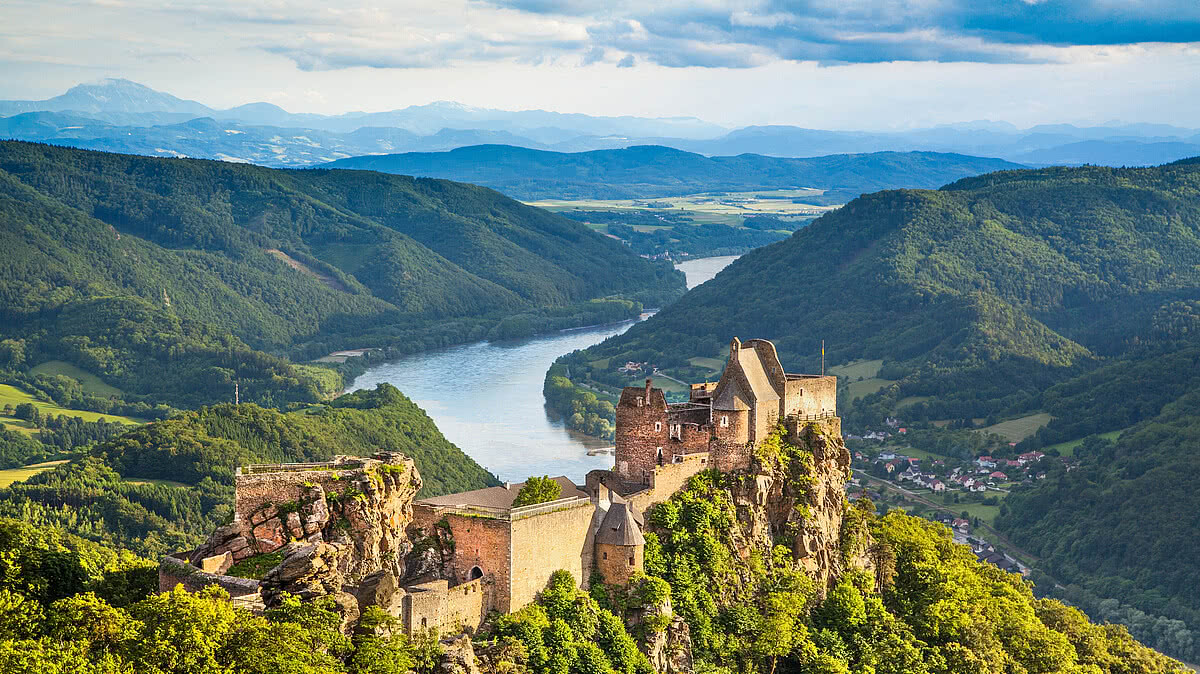 Beautiful landscape with Aggstein castle ruin and Danube river at sunset in Wachau, Austria